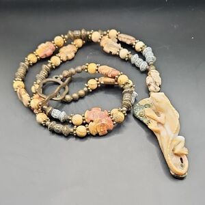 Handcrafted Beaded Necklace with Carved Pendant